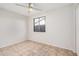 Cozy bedroom with a window offering natural light and neutral color palette at 4611 N 79Th Dr, Phoenix, AZ 85033