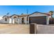 Beautiful single-story home showcasing an attached garage and a covered entryway with stylish arches at 4611 N 79Th Dr, Phoenix, AZ 85033