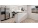 Bright kitchen featuring stainless steel appliances, white cabinets, and granite countertops at 4611 N 79Th Dr, Phoenix, AZ 85033