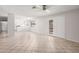 Open-concept living room with tile floors and views of the kitchen and backyard at 4611 N 79Th Dr, Phoenix, AZ 85033