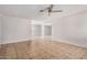 Spacious living room with tile floors, ceiling fan and plenty of natural light at 4611 N 79Th Dr, Phoenix, AZ 85033