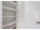 A well lit pantry with multiple shelving units at 4611 N 79Th Dr, Phoenix, AZ 85033