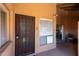 Welcoming front entrance with secured door, window, and view of the patio at 501 W Tonopah Dr # 7, Phoenix, AZ 85027