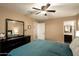 Primary bedroom featuring large dresser and access to ensuite bathroom at 501 W Tonopah Dr # 7, Phoenix, AZ 85027