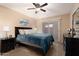 Cozy primary bedroom featuring a ceiling fan and sliding glass doors at 501 W Tonopah Dr # 7, Phoenix, AZ 85027