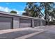 Assigned covered parking spaces in a row of garages at 5025 W New World Dr, Glendale, AZ 85302