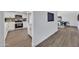 Modern kitchen with white cabinets, stainless steel appliances, and stylish flooring extending to the living area at 5025 W New World Dr, Glendale, AZ 85302