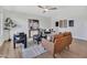Bright living room with modern furniture, decorative accents, and wood-look flooring at 5025 W New World Dr, Glendale, AZ 85302