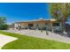Spacious backyard with desert landscaping, artificial turf, and shaded patio area with swing at 5031 W Grandview Rd, Glendale, AZ 85306