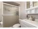 Modern bathroom featuring a vanity with sink, toilet, and a shower with sliding glass door at 5031 W Grandview Rd, Glendale, AZ 85306