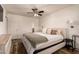 A serene bedroom with a queen bed, neutral decor, and an ensuite bathroom at 5031 W Grandview Rd, Glendale, AZ 85306
