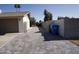 Long driveway with a brick paver design leads to the detached garage with secure, private access at 5031 W Grandview Rd, Glendale, AZ 85306