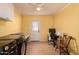 This yellow laundry room has new Samsung washer/dryer, workspace, and outdoor access at 5031 W Grandview Rd, Glendale, AZ 85306