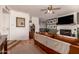 Comfortable living room features hardwood floors, a fireplace, and views into dining area at 5031 W Grandview Rd, Glendale, AZ 85306