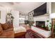 Open concept living room with fireplace, hardwood floors, and views into the dining room at 5031 W Grandview Rd, Glendale, AZ 85306