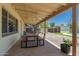 Spacious covered patio features a dining table, ceiling fan, and backyard views at 5031 W Grandview Rd, Glendale, AZ 85306