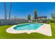 Refreshing pool with a modern pergola, inviting lounge chairs and well manicured artificial turf at 5031 W Grandview Rd, Glendale, AZ 85306