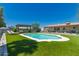 Lush backyard featuring a sparkling pool, outdoor lounge area and manicured landscaping at 5031 W Grandview Rd, Glendale, AZ 85306