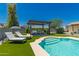 Beautiful pool with lounge chairs, an outdoor cabana and vibrant artificial turf at 5031 W Grandview Rd, Glendale, AZ 85306