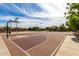 Outdoor basketball court with painted lines, hoops, and surrounding landscaping, perfect for recreational activities at 6235 S Odessa Dr, Gilbert, AZ 85298