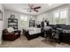 Inviting bedroom with a ceiling fan, natural light, and a cozy reading nook at 6235 S Odessa Dr, Gilbert, AZ 85298