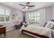 Serene bedroom featuring soft purple walls, large windows, and elegant decor at 6235 S Odessa Dr, Gilbert, AZ 85298