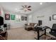 Cozy bonus room with sports memorabilia, a TV area, and a dedicated workspace for added functionality at 6235 S Odessa Dr, Gilbert, AZ 85298