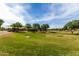 Expansive community park with playground, picnic areas, sand volleyball court, and grassy fields at 6235 S Odessa Dr, Gilbert, AZ 85298