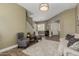 Inviting living room features a cozy seating area and staircase access, perfect for relaxation and easy movement at 6235 S Odessa Dr, Gilbert, AZ 85298