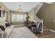 Comfortable living room with neutral tones, plush rug, and staircase access at 6235 S Odessa Dr, Gilbert, AZ 85298