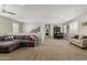 Spacious open loft area with plush carpeting, comfortable seating, and a charming dining set at 6235 S Odessa Dr, Gilbert, AZ 85298