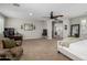 Expansive main bedroom area with stylish decor, ceiling fan, and a versatile layout at 6235 S Odessa Dr, Gilbert, AZ 85298
