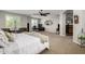 Large main bedroom with ceiling fan, desk, sitting area, and ample natural light at 6235 S Odessa Dr, Gilbert, AZ 85298
