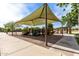 Community playground featuring shade and multiple play structures for enjoyment at 6235 S Odessa Dr, Gilbert, AZ 85298