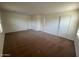Spacious bedroom featuring neutral carpet, and multiple doors with white trim at 6339 W Sophie Ln, Laveen, AZ 85339