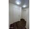 A bright entryway with dark floors and white walls at 6339 W Sophie Ln, Laveen, AZ 85339