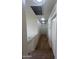 Upstairs hallway with carpet, overhead lighting, and multiple doors at 6339 W Sophie Ln, Laveen, AZ 85339