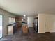 Kitchen with an island, stainless steel appliances, and an adjacent dining area at 6339 W Sophie Ln, Laveen, AZ 85339
