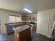 A cozy kitchen with stainless steel appliances and an island at 6339 W Sophie Ln, Laveen, AZ 85339