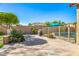 A well-manicured backyard featuring mature landscaping, a barbecue, and an outdoor seating area at 6808 W Angela Dr, Glendale, AZ 85308