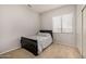 Bedroom with neutral carpet, window, grey walls, and bed at 6808 W Angela Dr, Glendale, AZ 85308