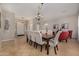 Dining room features a large table with upholstered chairs at 6808 W Angela Dr, Glendale, AZ 85308
