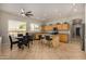 This spacious kitchen features an island, granite counters, stainless appliances, and a cozy breakfast nook at 6808 W Angela Dr, Glendale, AZ 85308
