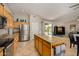 Featuring stainless appliances, a large island with granite counters, and an open layout with backyard access at 6808 W Angela Dr, Glendale, AZ 85308