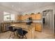 This kitchen features an island, granite counters, stainless appliances, and ample cabinet space at 6808 W Angela Dr, Glendale, AZ 85308