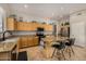 Modern kitchen with a granite island, stainless appliances, and cabinetry for storage, perfect for cooking and entertaining at 6808 W Angela Dr, Glendale, AZ 85308
