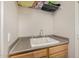 Laundry room with utility sink and storage at 6808 W Angela Dr, Glendale, AZ 85308
