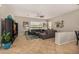 Comfortable living room with a gray sectional sofa, ceiling fan, and modern decor at 6808 W Angela Dr, Glendale, AZ 85308