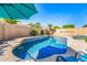 Sparkling pool surrounded by lush landscaping and a private patio area at 6808 W Angela Dr, Glendale, AZ 85308