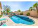 Sparkling pool featuring tile accents and meticulously landscaped surroundings at 6808 W Angela Dr, Glendale, AZ 85308